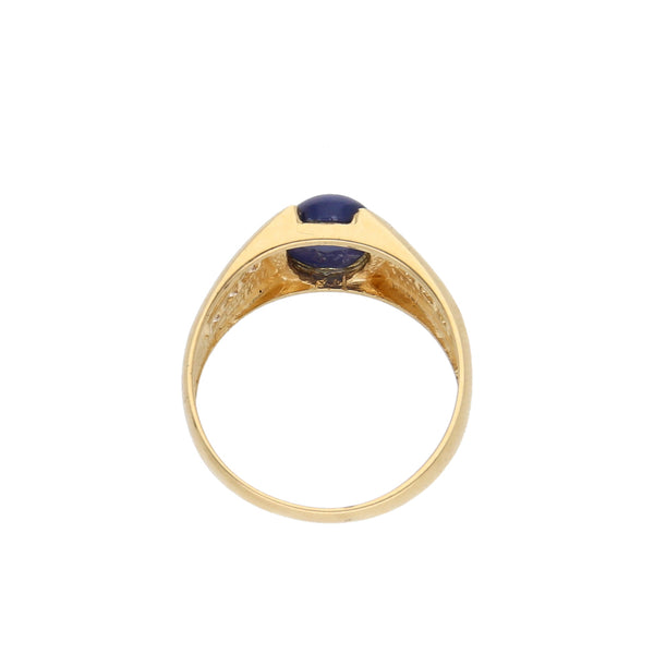 Anillo diseño especial con zafiro estrella y circonias en oro amarillo 10 kilates.