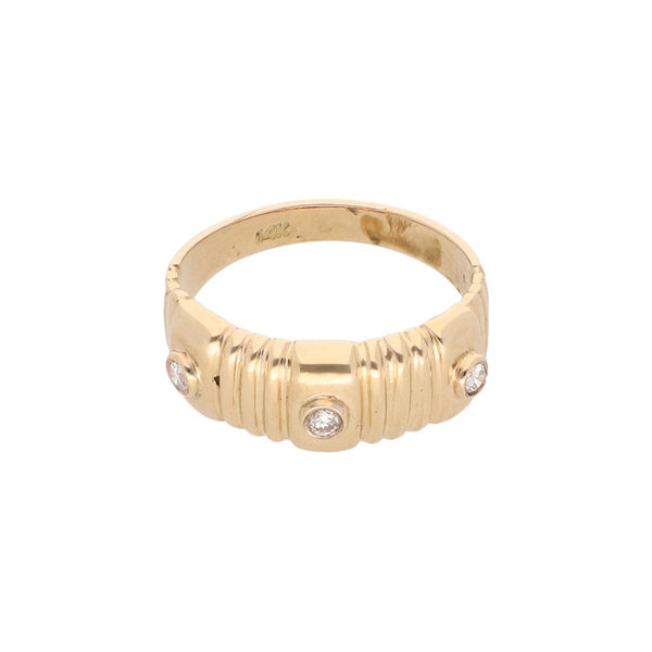 Anillo acanalado con diamantes en oro amarillo 14 kilates.