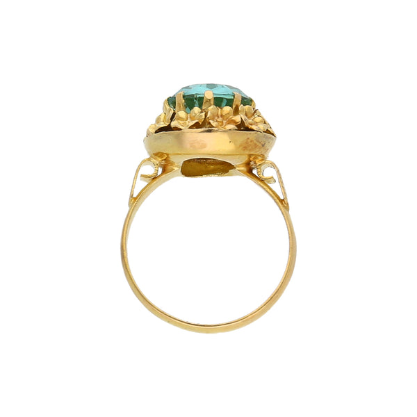 Anillo calado motivo floral con sintético en oro amarillo 14 kilates.