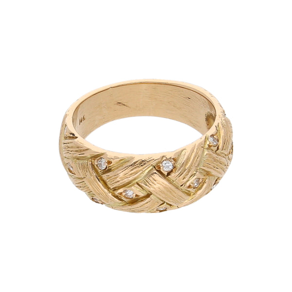 Anillo estilizado con diamantes en oro amarillo 14 kilates.