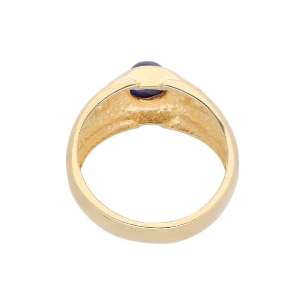 Anillo diseño especial con zafiro estrella y circonias en oro amarillo 14 kilates.