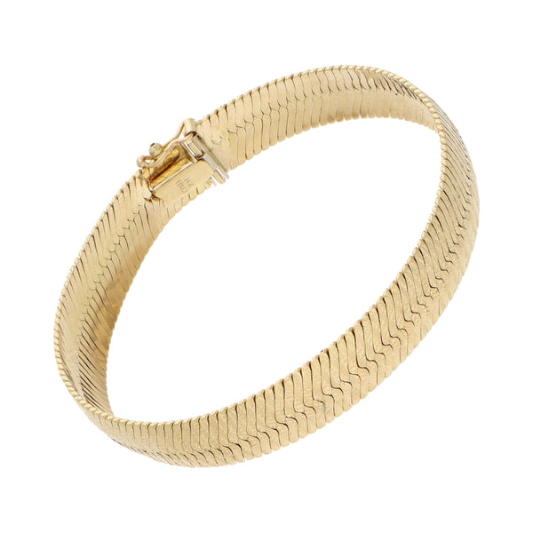 Pulsera eslabón planchado en oro amarillo 14 kilates.