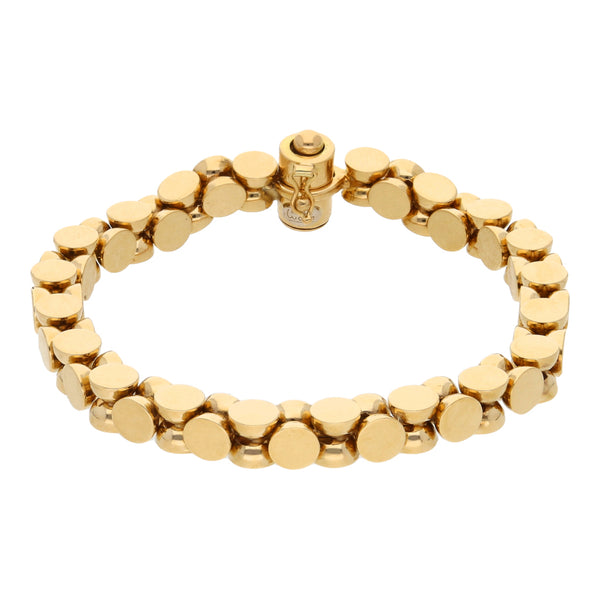 Pulsera eslabón cruzado en oro amarillo 18 kilates.