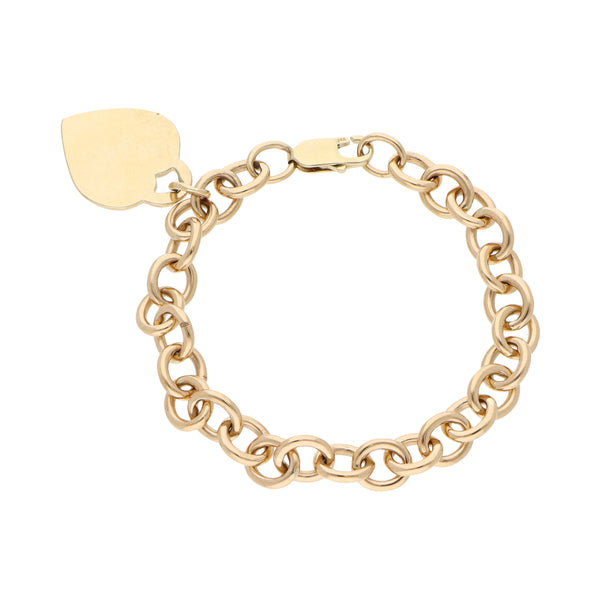 Pulsera eslabón cruzado con colgante motivo corazón en oro amarillo 14 kilates.