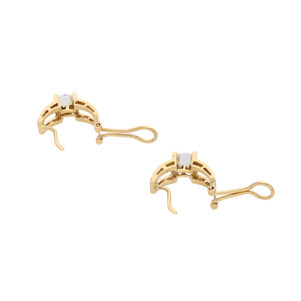 Aretes calados con circonia en oro amarillo 14 kilates.