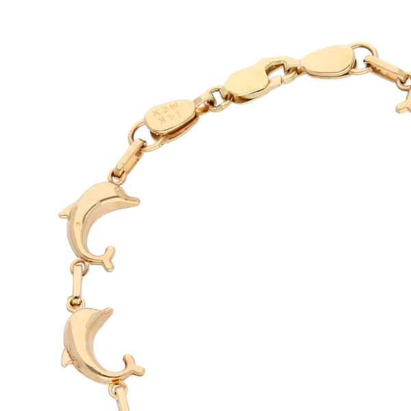 Pulsera eslabón combinado motivo delfines en oro amarillo 14 kilates.