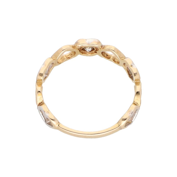 Anillo calado motivo corazones con circonia en oro amarillo 14 kilates.