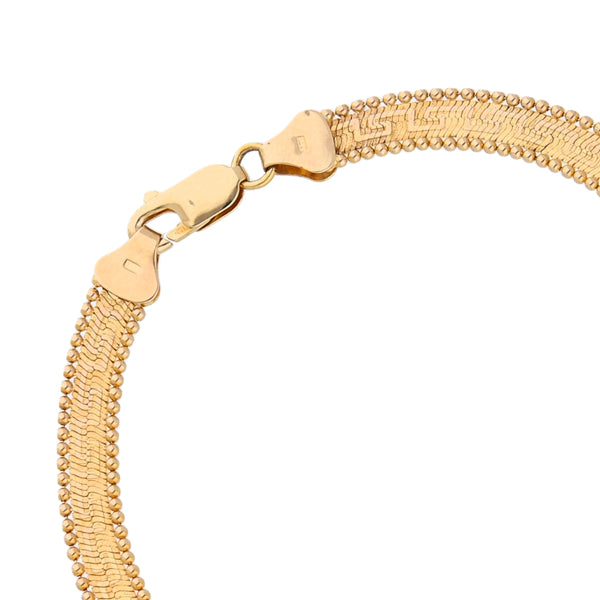 Pulsera eslabón boleado motivo grecas en oro amarillo 14 kilates.