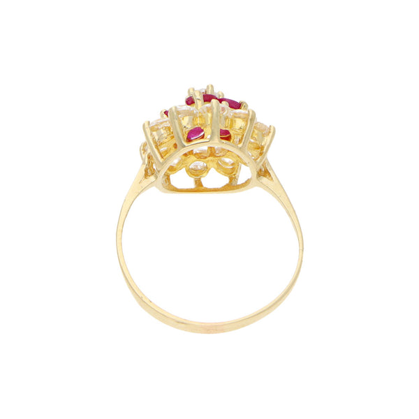 Anillo calado motivo floral con rubíes y circonias en oro amarillo 14 kilates.