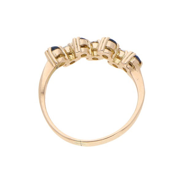 Anillo diseño especial con zafiros y circonias en oro amarillo 10 kilates.