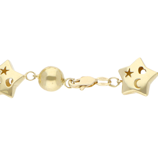 Pulsera eslabón combinado motivo estrellas y esferas en oro amarillo 14 kilates.