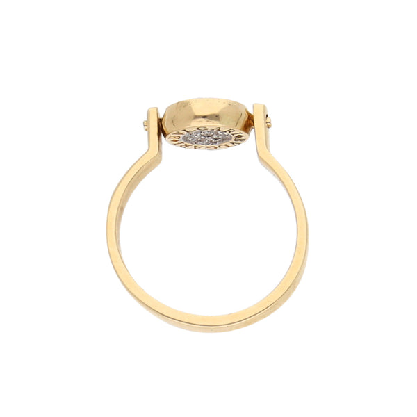 Anillo giratorio con diamantes y sintético en oro amarillo 14 kilates.