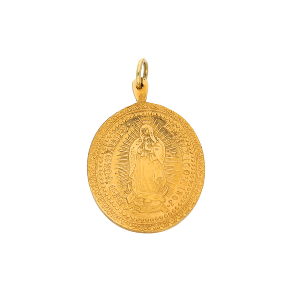 Medalla troquelada motivo Virgen de Guadalupe en oro amarillo 18 kilates.