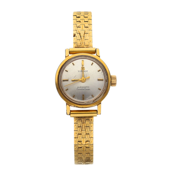 Reloj Tissot para dama modelo SeaStar Seven correa oro amarillo 18 kilates.