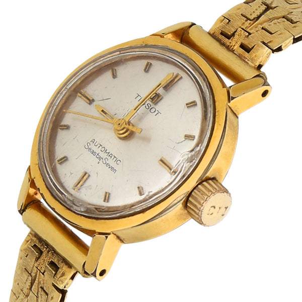 Reloj Tissot para dama modelo SeaStar Seven correa oro amarillo 18 kilates.