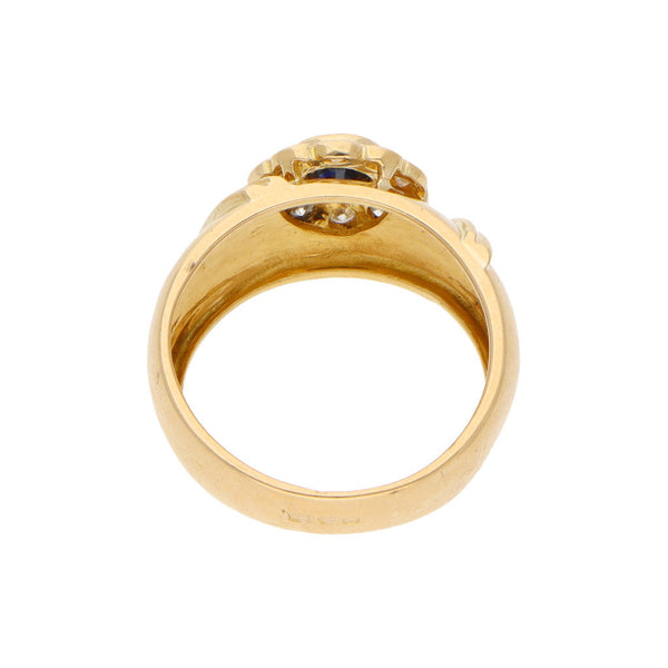 Anillo diseño especial con diamantes y zafiro en oro amarillo 18 kilates.