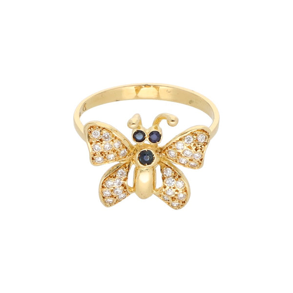 Anillo estilizado calado firma Pelletier motivo mariposa con diamantes y zafiros en oro amarillo 18 kilates.