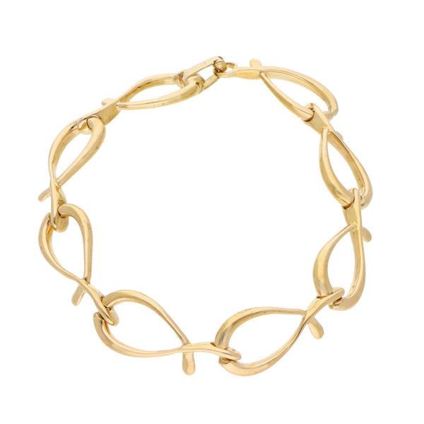 Pulsera eslabón cruzado firma Tane en oro amarillo 18 kilates.