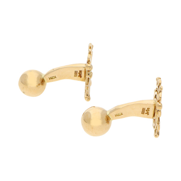 Mancuernillas estilizadas firma Tane en oro amarillo 18 kilates.
