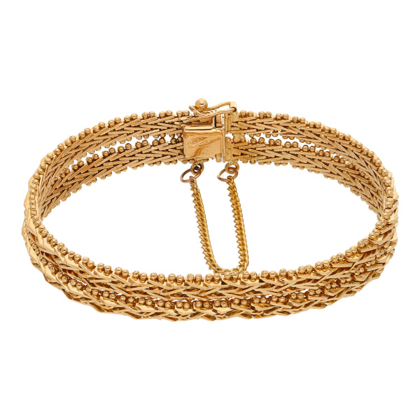 Pulsera dos hilos eslabón boleado en oro amarillo 18 kilates.