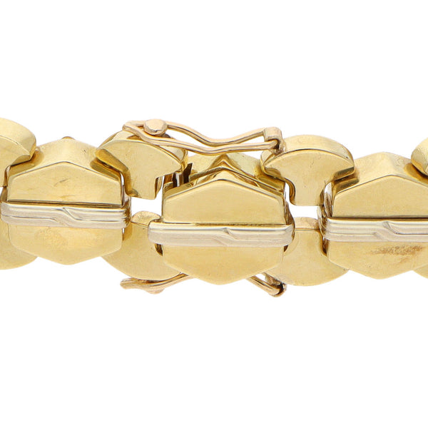 Pulsera eslabón articulado combinado en oro dos tonos 18 kilates.