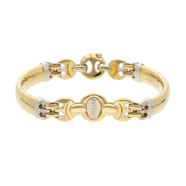 Pulsera eslabón articulado combinado con aplicación en oro dos tonos 18 kilates.