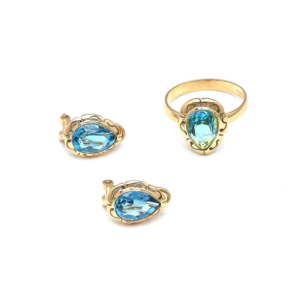 Juego de anillo y aretes calados con topacios azules en oro amarillo 14 kilates.