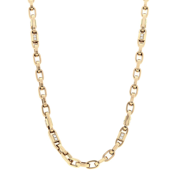 Collar eslabón cruzado combinado con circonias en oro amarillo 14 kilates.