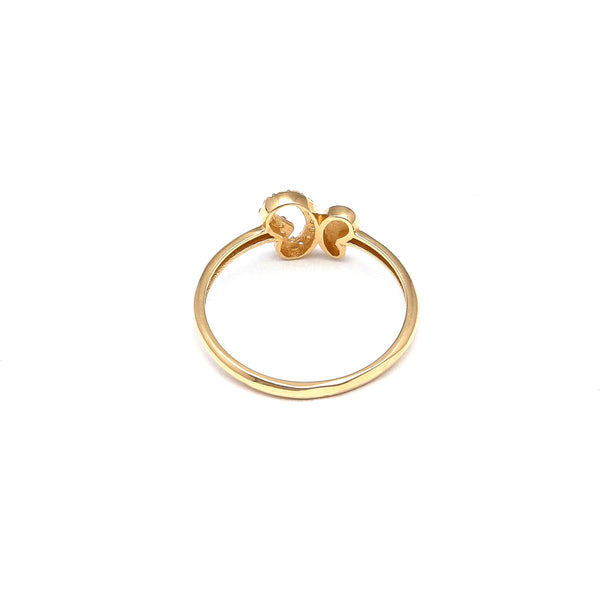 Anillo calado motivo mariposa con circonias en oro amarillo 14 kilates.