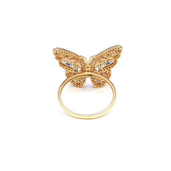 Anillo estilizado motivo mariposa con sintéticos en oro amarillo 14 kilates.