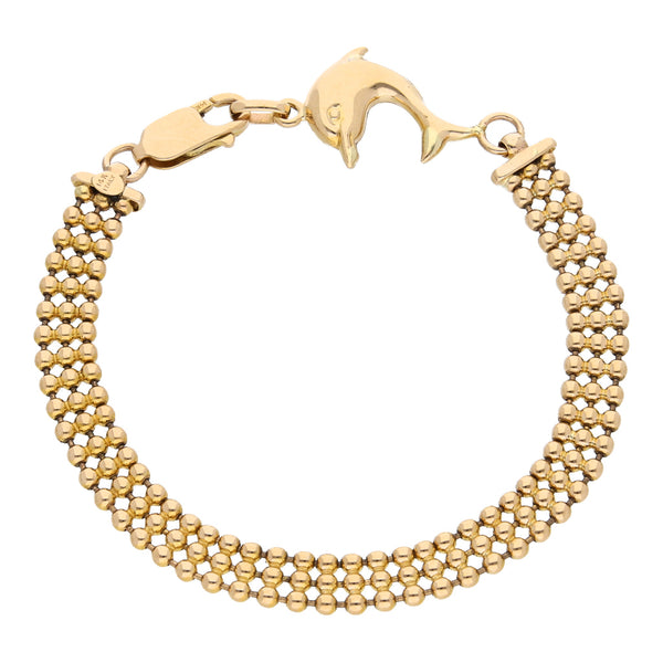 Pulsera eslabón boleado con aplicación motivo delfín en oro amarillo 14 kilates.