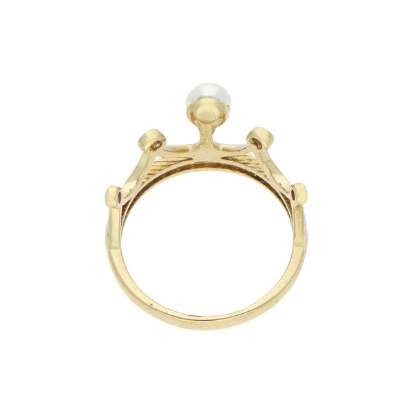 Anillo diseño especial motivo corona con perla y circonias en oro amarillo 10 kilates.