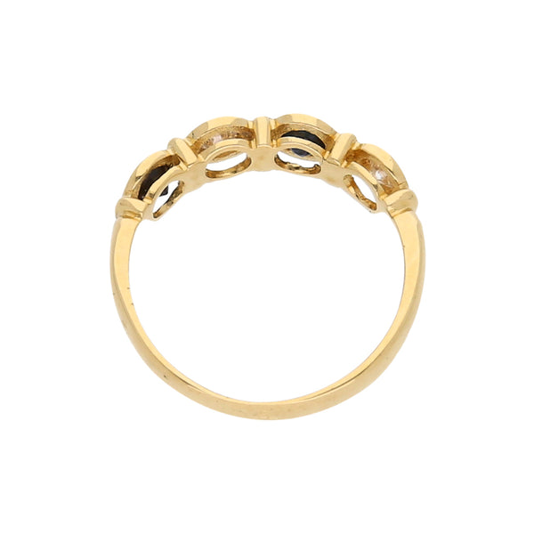 Anillo diseño especial con diamantes y zafiros en oro amarillo 18 kilates.