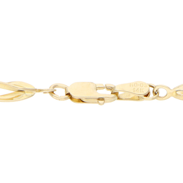 Pulsera eslabón combinado en oro amarillo 14 kilates.