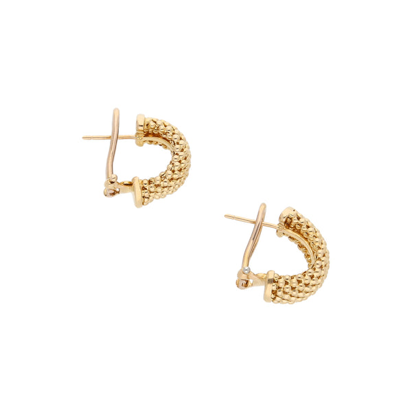 Aretes boleados en oro amarillo 14 kilates.