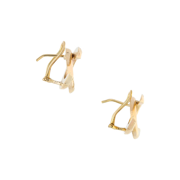 Aretes estilizados en oro amarillo 14 kilates.