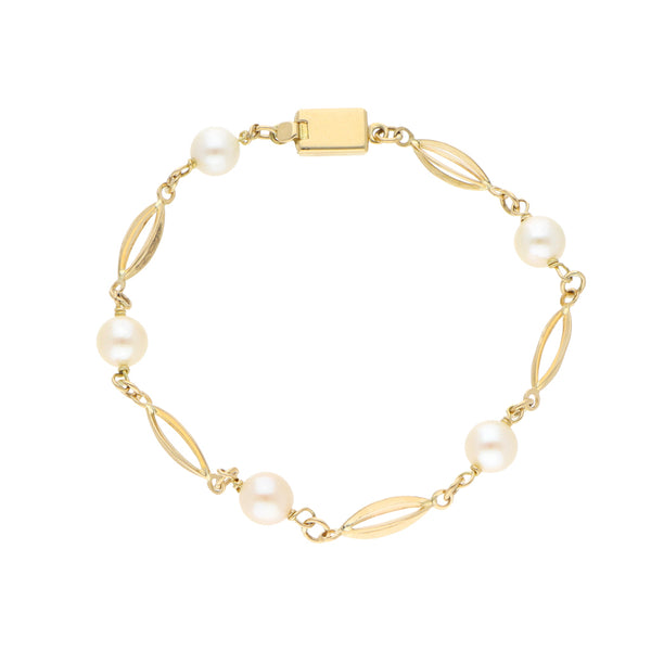 Pulsera eslabón combinado con perlas en oro amarillo 18 kilates.