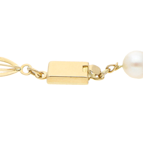 Pulsera eslabón combinado con perlas en oro amarillo 18 kilates.