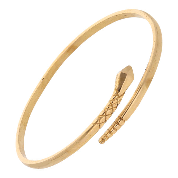 Pulsera rígida abierta motivo serpiente en oro amarillo 14 kilates.