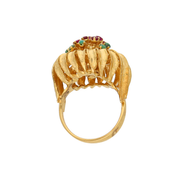 Anillo estilizado con rubíes y turquesas en oro amarillo 18 kilates.