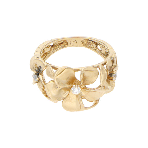 Anillo calado motivo floral con circonias en oro amarillo 14 kilates.