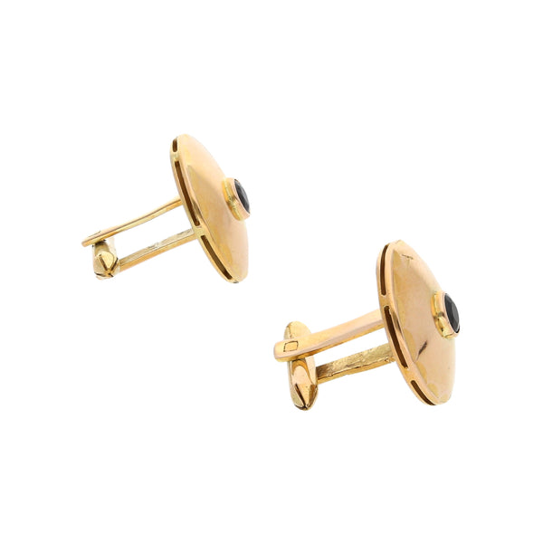 Mancuernillas diseño especial con zafiros en oro amarillo 14 kilates.