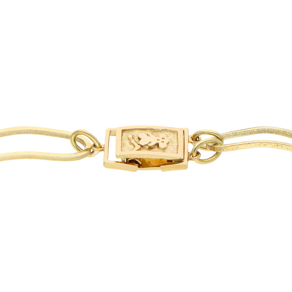 Pulsera eslabón combinado en oro amarillo 18 kilates.