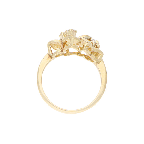 Anillo estilizado motivo floral con circonias en oro amarillo 14 kilates.