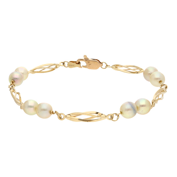 Pulsera eslabón combinado con perlas en oro amarillo 14 kilates.