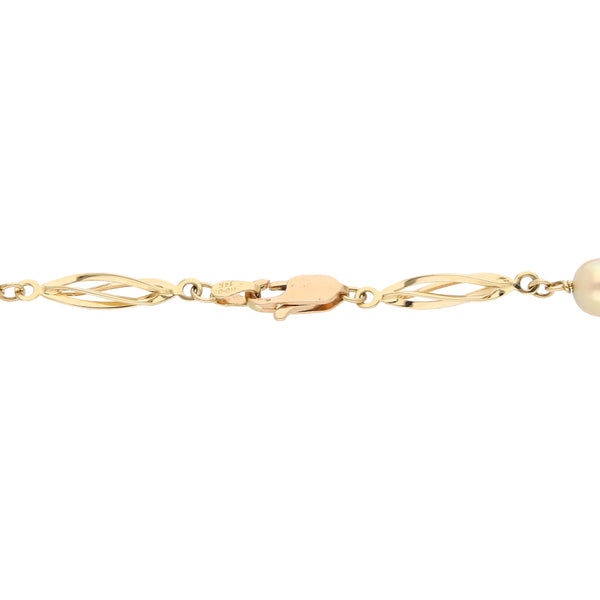 Pulsera eslabón combinado con perlas en oro amarillo 14 kilates.