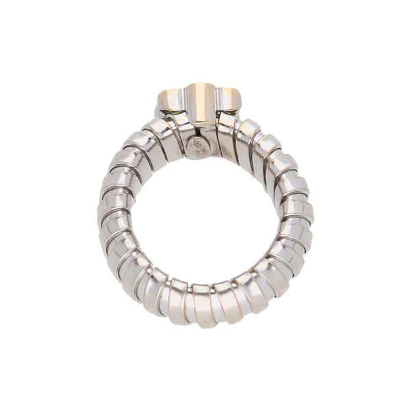 Anillo flexible con sintéticos en oro blanco 18 kilates.