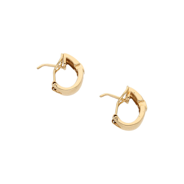 Aretes diseño especial con circonias en oro amarillo 14 kilates.