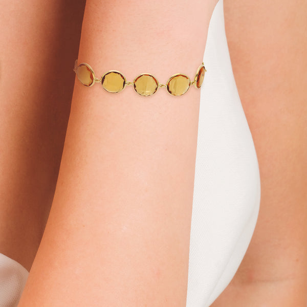 Pulsera eslabón combinado con sintéticos en oro amarillo 18 kilates.