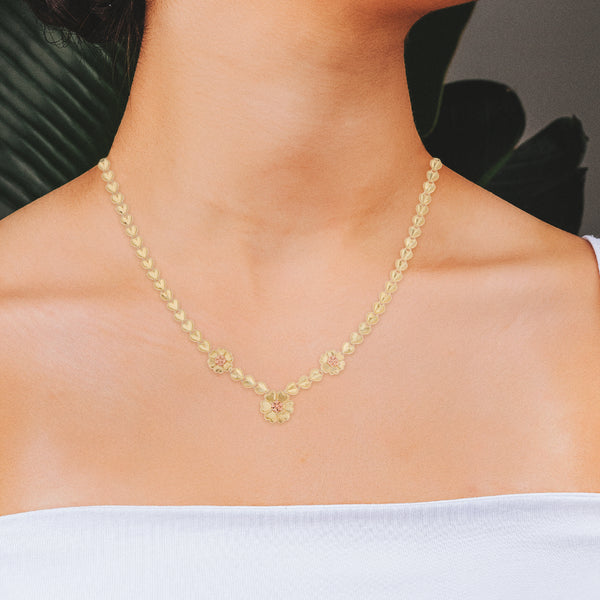 Collar eslabón combinado platinado con colgante y aplicaciones motivo floral en oro dos tonos 14 kilates.